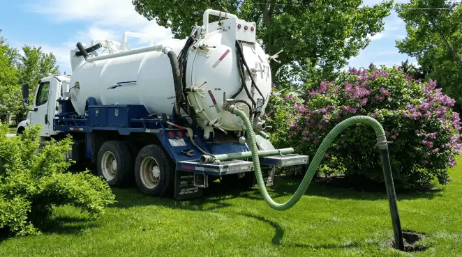 Professional vacuum truck performing residential drainage and septic maintenance in Boise, ID